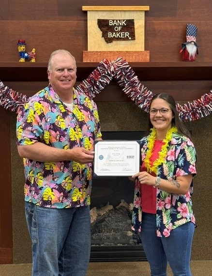 Employee and South Dakota National Guardsman presents President Dean Wang with the Patriotic Employer Award.